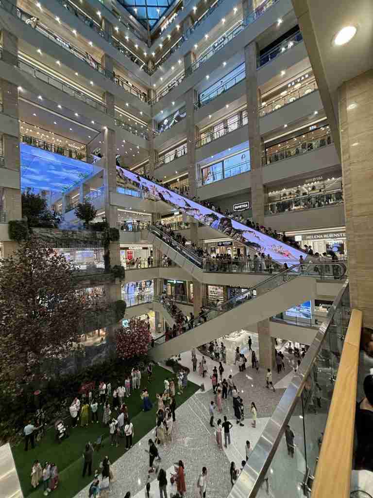 The iconic 50.3-meter-long indoor escalator at SEG International Shopping Center in Xi'an, China, recognized as the longest in Asia, inside the multi-story atrium.