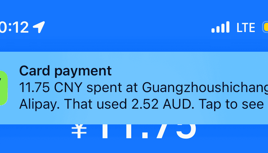 Alipay screen showing a successful payment for a coffee order using a linked international Wise card in China