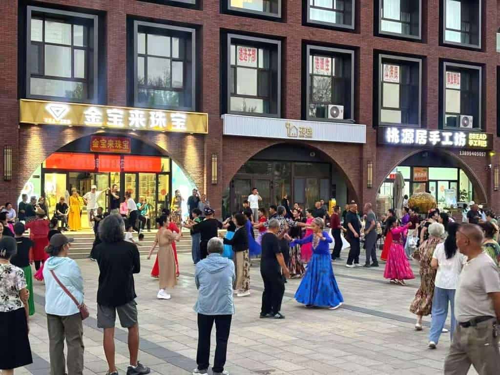 Evening dancing in the square at Wubaili Block, Altay City, Xinjiang