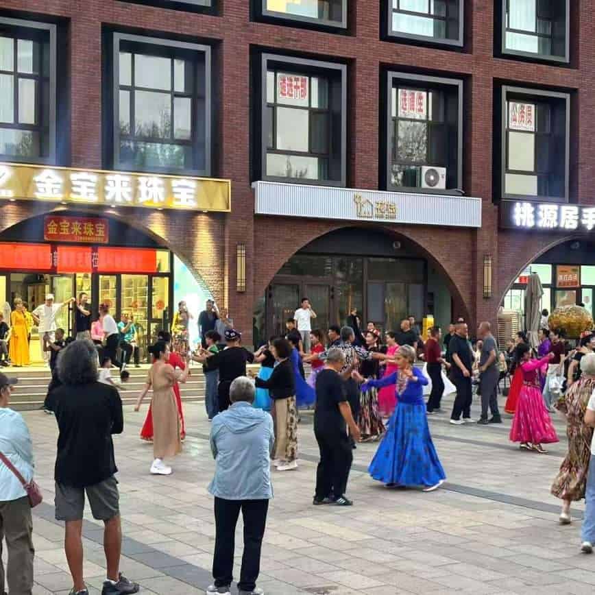 Evening dancing in the square at Wubaili Block, Altay City, Xinjiang