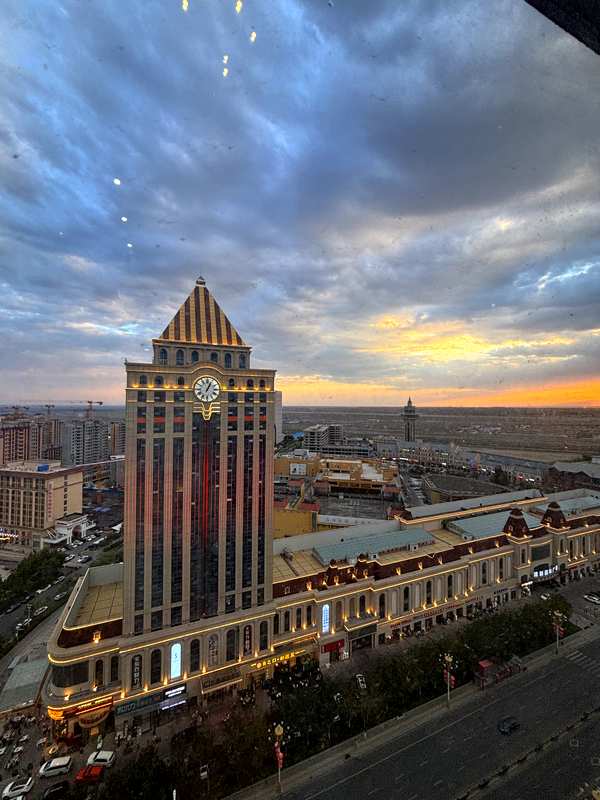 Sunset view over Horgos from our hotel window, with Kazakhstan visible in the desert beyond the city