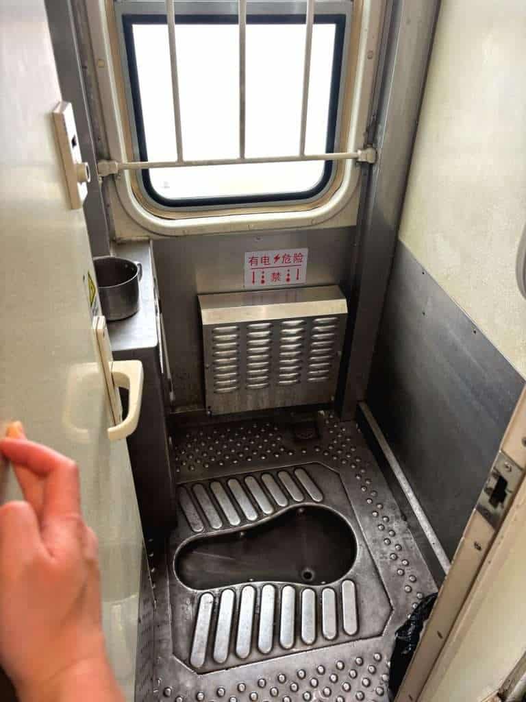 Shared squat toilet on a China sleeper train