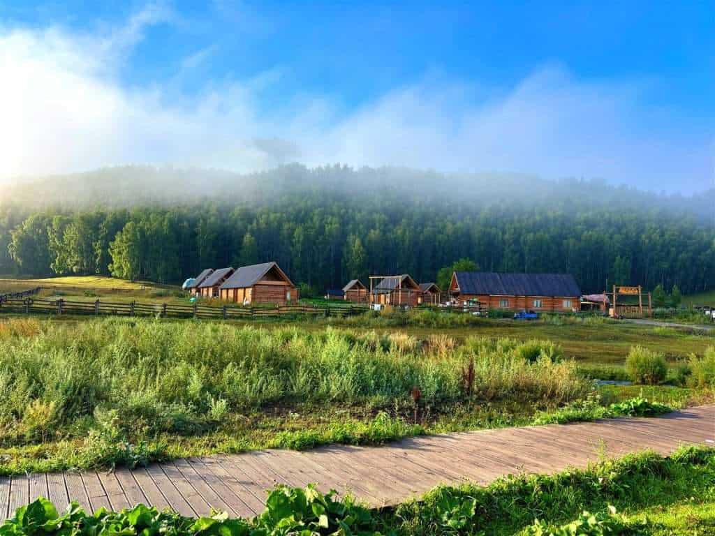 Morning view from the Hadeng Viewing Platform boardwalk, layered mountains and valley fog under a clearing sky