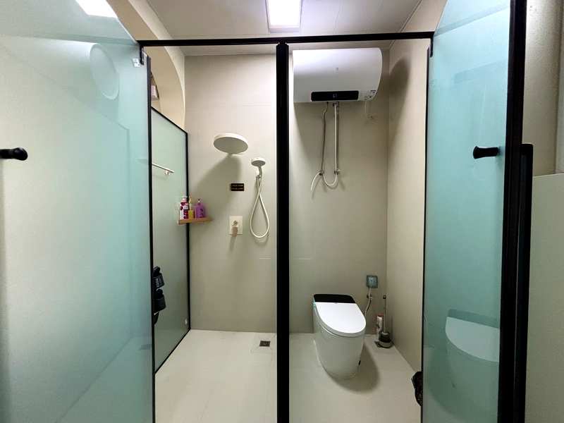Our bathroom in Bole, with opaque glass walls dividing the wet and dry areas