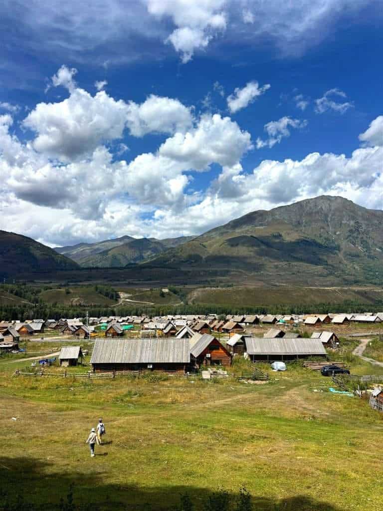 Green valley view of Hemu Village seen from within the birch forest walking trail
