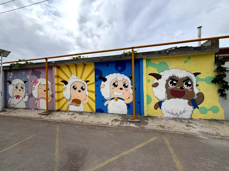Cartoon sheep mural street art in Bole, Xinjiang