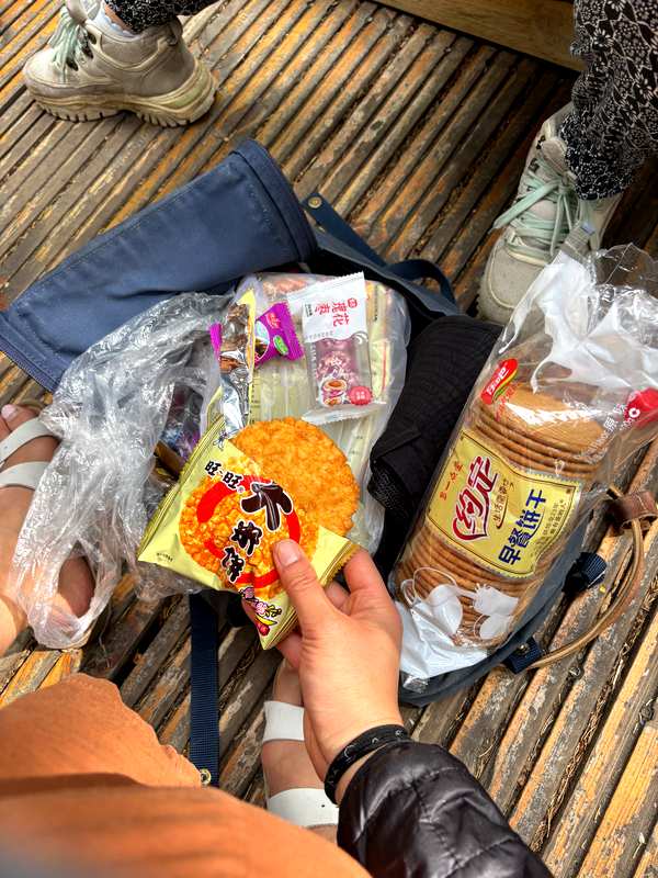 Trail snacks on the boardwalk between Moon Bay and Shenxian Bay at Kanas