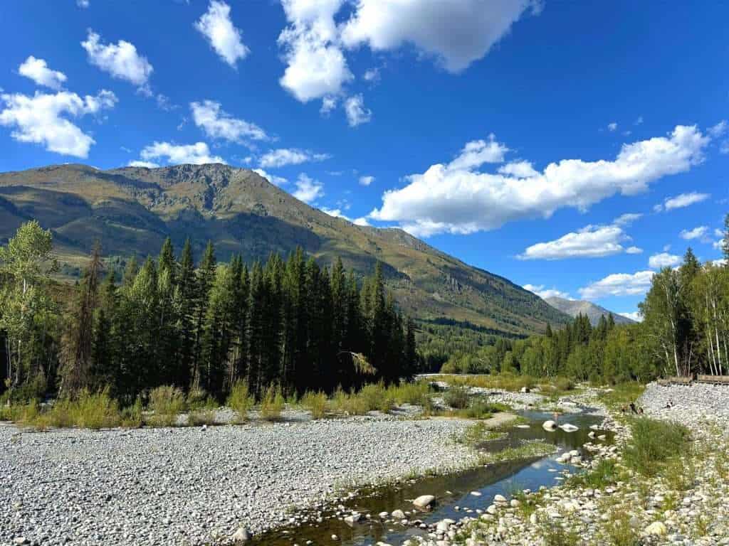 View along the eastern end of the riverside walkway near Hadeng Viewing Platform in Hemu Village