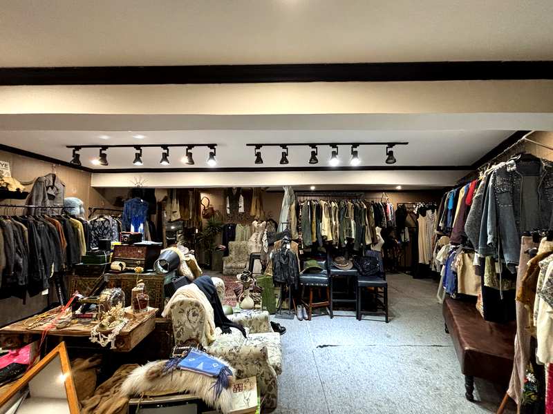 Underground vintage clothing shop beneath a cafe bar