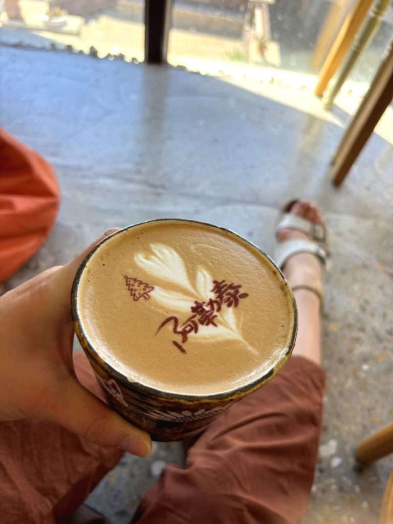 Sitting upstairs at the cafe with a latte